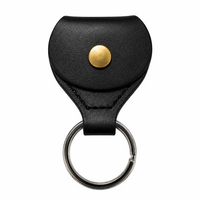 Prathmesh Music black leather guitar pick holder keychain with a gold snap button closure.