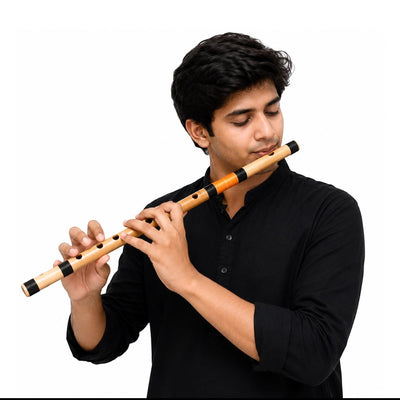 Musician playing a Radhe Bamboo Side G# Mid Flute from Prathmesh Music, featuring natural bamboo and black bindings.
